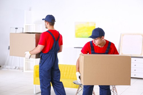 Removal van and movers serving a residential street in Lambeth