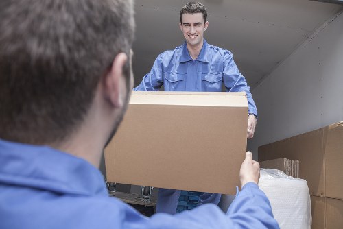 Removal team managing a home move in a Lambeth street