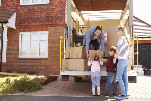 Moving van with reusable furniture and sorted recycling in Lambeth