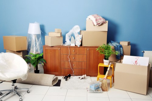 Family moving day preparation with labeled boxes in a Lambeth property