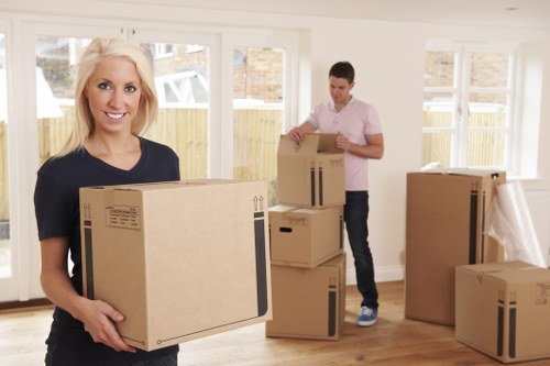 Careful wrapping of household items for a move in Lambeth