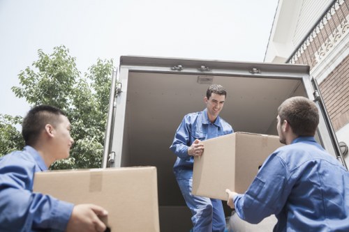 Packed household items and furniture secured for transport in Lambeth