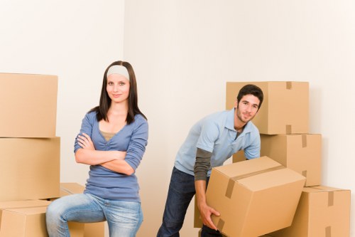 Loading boxes and household items into a van for a Lambeth move