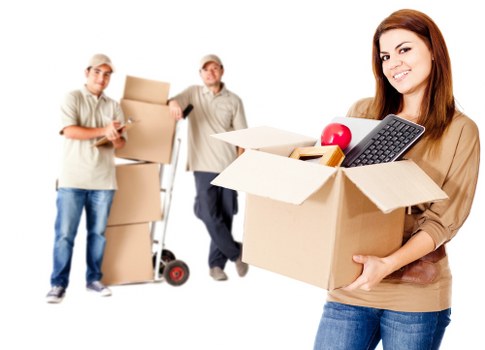Packed boxes and furniture ready for a removals team