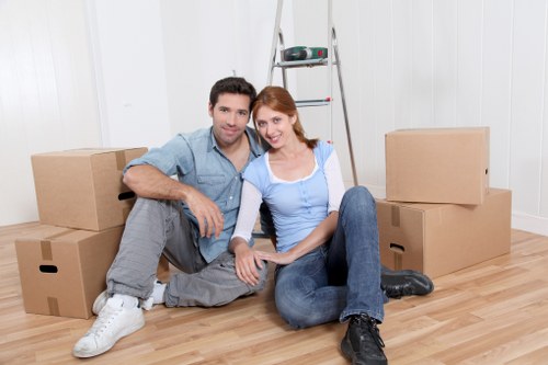 Local removal team handling furniture in a South London street